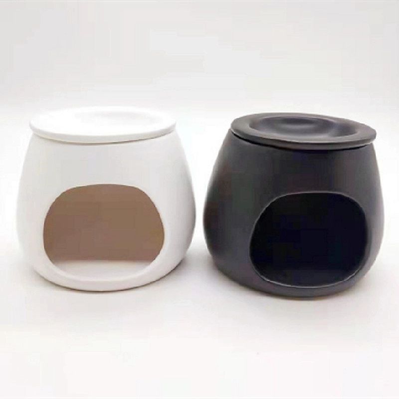 Handgemachtes Wachsbrenner aus weißer und schwarzer Keramik